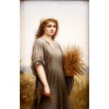 A 19TH CENTURY BERLIN TYPE PORCELAIN PLAQUE painted with a young maiden carrying a sheaf of corn