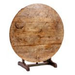 AN EARLY 19th CENTURY BLEACHED ELM AND PAINTED CIRCULAR TILT TOP TABLE with sledge style base and