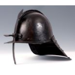 A LOBSTER TAILED HELMET with single nasal bar and two piece skull of the type used during the