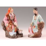 A PAIR OF EARLY 20TH CENTURY CHINESE FAMILE ROSE FIGURES  of two seated Chinese Sages in oriental