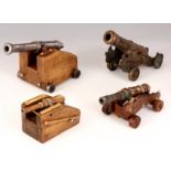 FOUR 19TH CENTURY AND LATER MINATURE BRONZE AND STEEL CANNONS on wooden bases, the largest cannon is