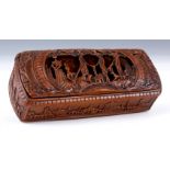 A 19TH CENTURY COQUILLA NUT TOBACCO BOX finely carved with houses and a relief carved scene to the