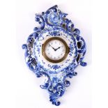 AN EARLY 19TH CENTURY BLUE AND WHITE DELFTWARE MINIATURE CARTEL CLOCK having a 1.5" enamel dial with