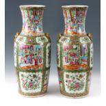 A LARGE PAIR OF 19th CENTURY CHINESE CANTON VASES decorated in the Famile Rose palette depicting