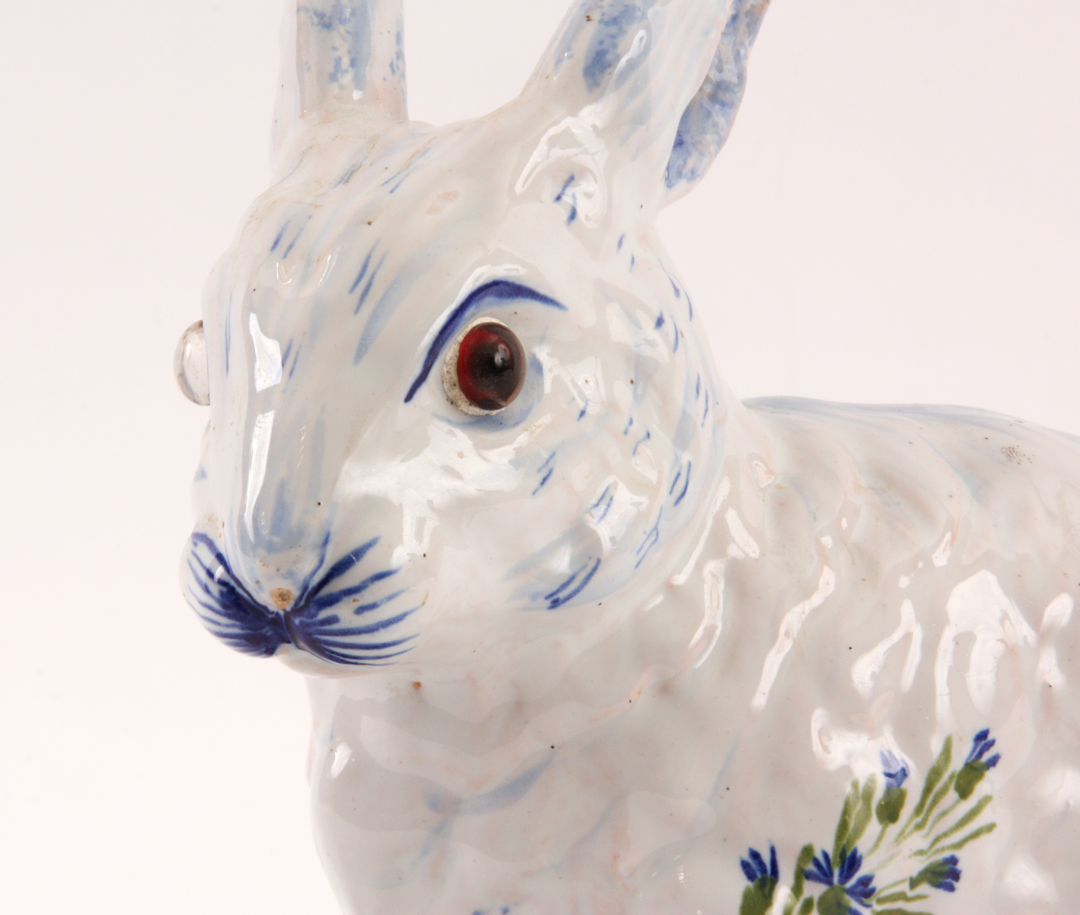 A DELFT STYLE GLAZED SEATED RABBIT with amber eyes and decorated flower spray decoration, the - Image 3 of 5