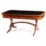 A REGENCY ROSEWOOD LIBRARY TABLE in the manner of John McLean with tooled leathered writing