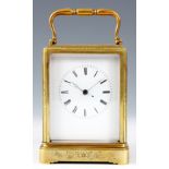 A 19th CENTURY ENGRAVED ONE PIECE CASE CARRIAGE CLOCK the case with floral engraved panels enclosing