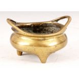 A CHINESE MINIATURE BRONZE CENSER with dragon decoration to inner bowl and six character marks to