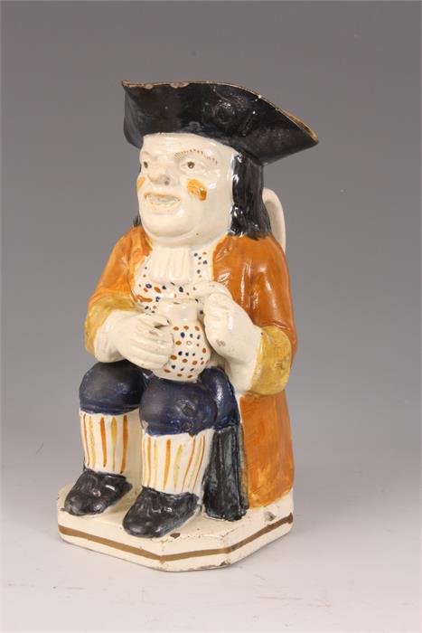 A GEORGE III STAFFORDSHIRE TOBY JUG the seated man holding a jug of ale in ochre hat with mustard - Image 5 of 10