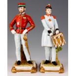 A PAIR OF LATE 19TH CENTURY GERMAN PORCELAIN FIGURES DEPICTING SOLDIERS one with red jacket and