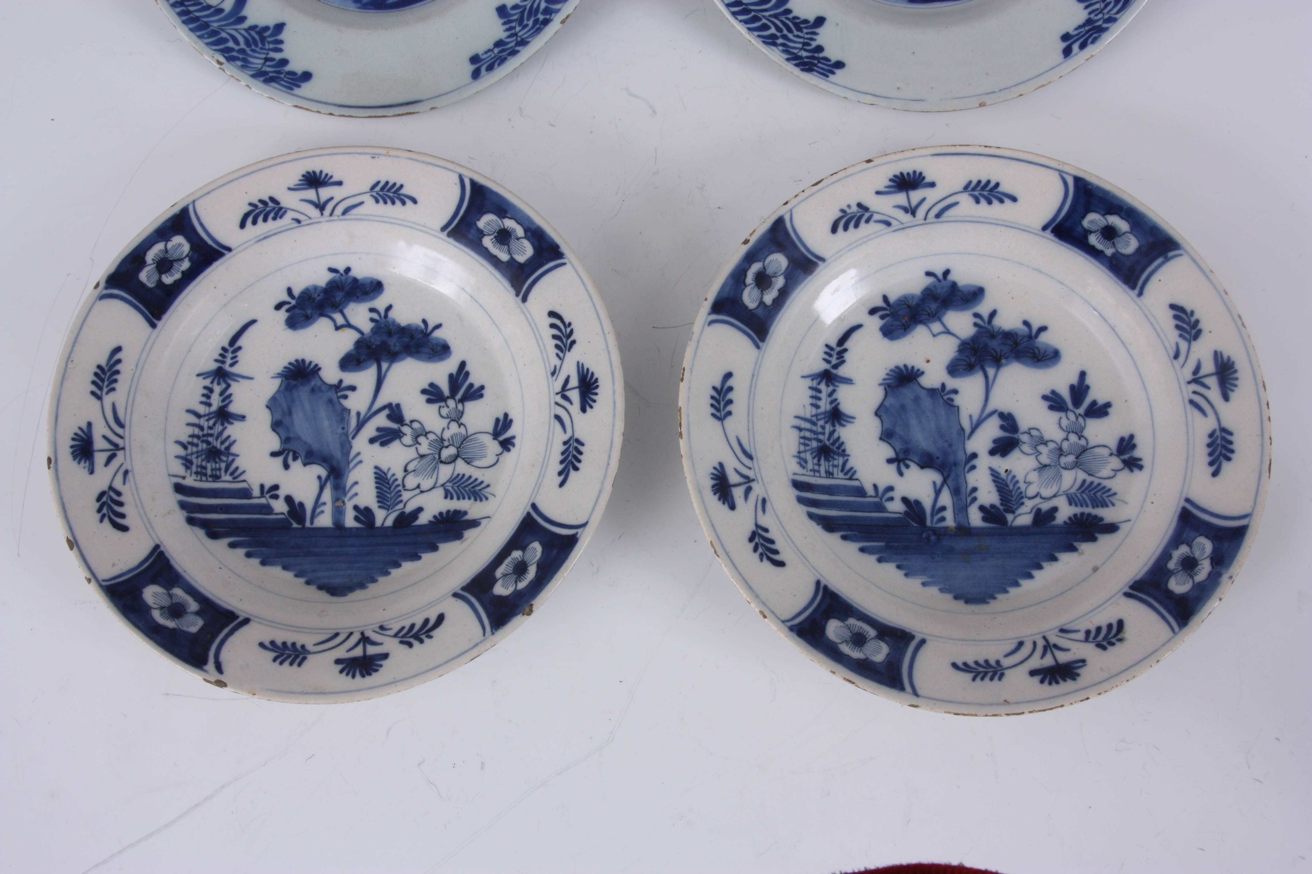 TWO PAIRS OF 18TH CENTURY DUTCH DELFT PLATES with tree lined landscape centres and floral panelled - Image 5 of 6