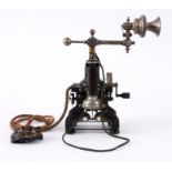 AN EXCEPTIONALLY RARE L.M. ERICSSON TELEPHONE WITH SWIVELLING MICROPHONE the cast iron frame with