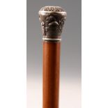 A LATE 19th CENTURY SILVER HANDLED MALACCA WALKING STICK decorated with figures in a garden