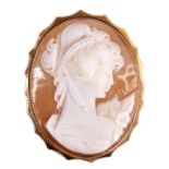 A 9CT GOLD MOUNTED CAMEO BROOCH portrait of a young lady 56mm long 44mm wide, total weight app. 14.