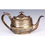 A GEORGE III OVAL SILVER TEAPOT with bright cut ribbed body and hinged lid 29cm across London 1803