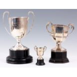 A COLLECTION OF THREE TWO HANDLED SILVER TROPHY CUPS including A Large Circular Cup 18cm high plus