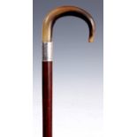 AN EARLY 20TH CENTURY HORN HANDLED WALKING CANE the silver collar inscribed: Presented to A E Moon