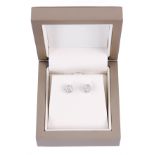 A PAIR OF 18ct WHITE GOLD AND DIAMOND CLUSTER EARRINGS each with seven stones totalling 1 carat -