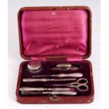 AN EARLY 20th CENTURY SEVEN PIECE SILVER MANICURE SET in original fitted velvet lined case - William