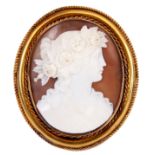 A GOLD MOUNTED CAMEO BROOCH portrait of a woman with a garland in her hair, the mount with rope