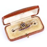 A 14ct GOLD AND ENAMEL ROYAL ARTILLERY BAR BROOCH the canon wheel set with diamond, in fitted case -