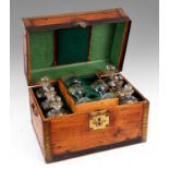 A 19TH CENTURY BRASS BOUND OAK CAMPAIGNE FITTED DECANTER BOX the lined divided interior fitted