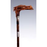 A LATE VICTORIAN CARVED HORN HANDLED PALM WOOD WALKING CANE the handle formed as Leda and the Swan