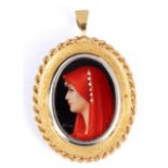 AN 18ct GOLD MOUNTED BROOCH with painted portrait of a young woman inset with diamonds 3.5cm