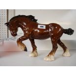 Royal Doulton Brown glazed horse left foot up, marked to base