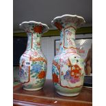 Pair of Late 19thC Meiji Period floral decorated vases with figural panels and flared tops,