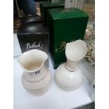 2 Boxed Belleek vases in cream finish with gilt banding, brown marks to base