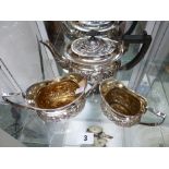Edwardian 3 Piece Silver plated tea set with embossed foliate detail with applied ebony handle and