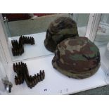 American GI Vietnam Camouflage helmet with assorted decoration and comments and a Chain of brass