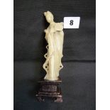 Chinese green soapstone carved figure of a woman in traditional dress on dark soapstone base, 15.5cm