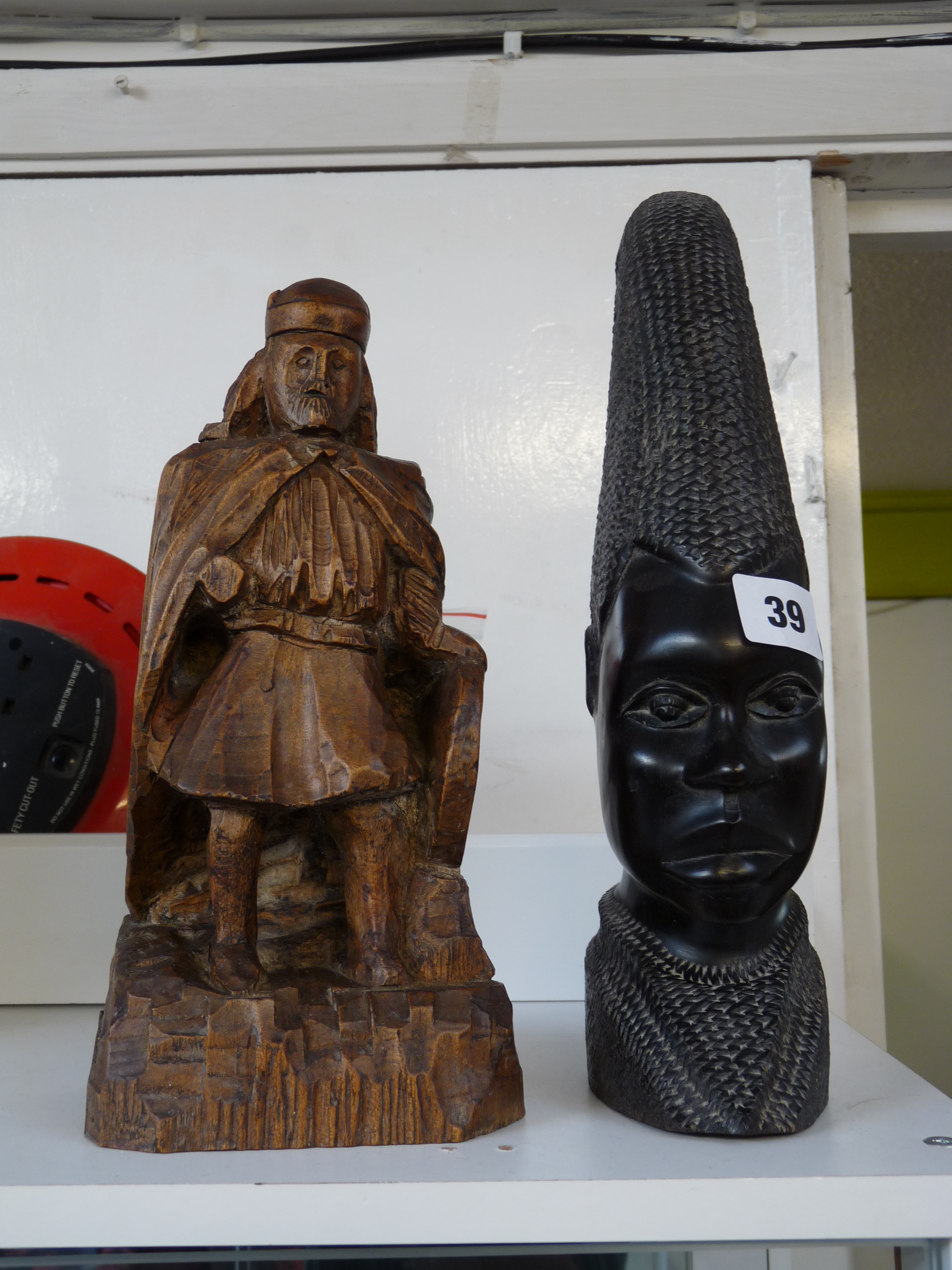 African Hardwood Tribal head carving and a Naïve wooden carving of a Nordic warrior, Condition -
