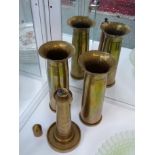 Pair of Brass Trench Art flared vases 40mm dated 1942 and a Trench Art Brass table lighter in the