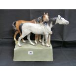 Large Goldscheider figure of dapple grey horse and light brown horse on light green rectangular