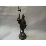 Late 19thC Spelter figure of a pole bearer in 18thC Clothing mounted on circular base with shield '