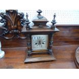 Junghans Oak cased bracket clock with roman numeral dial and applied brass decoration