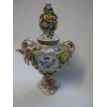 Good Quality 20thC European Porcelain floral decorated lidded vase with flanked cherubs around