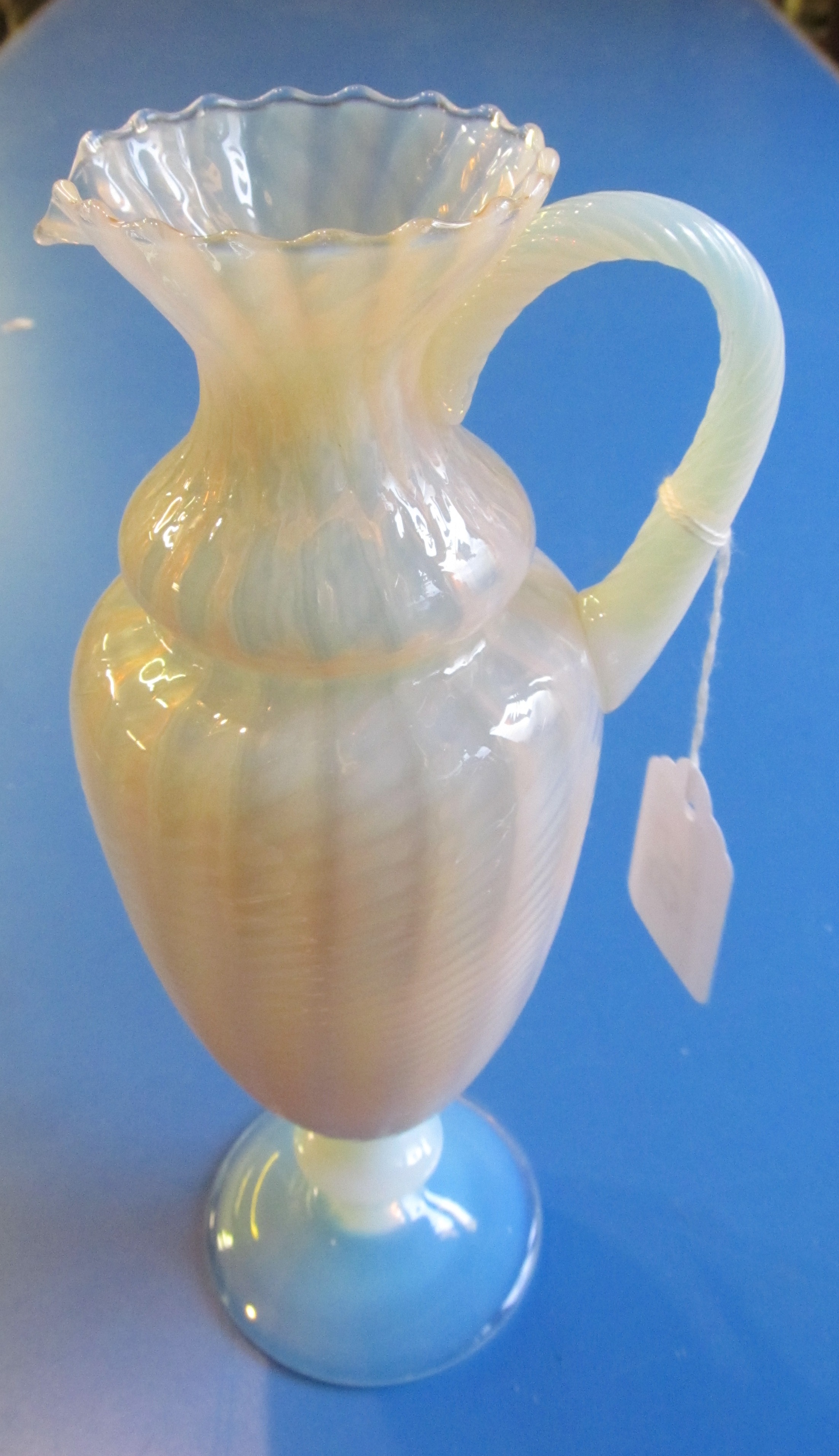 A vaseline Uranium glass jug