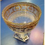 A cut glass bowl with gilt floral rim