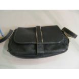 A blue leather handbag marked Hermes