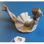 A Lladro Ballerina lying on her front.