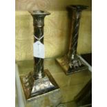 A pair of silver-plated neo-classical candlesticks