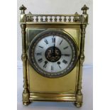 A 19th Century brass mantel clock with gallery and 8 day striking movement.