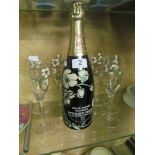 A bottle Belle Époque Champagne 1985 and seven glasses