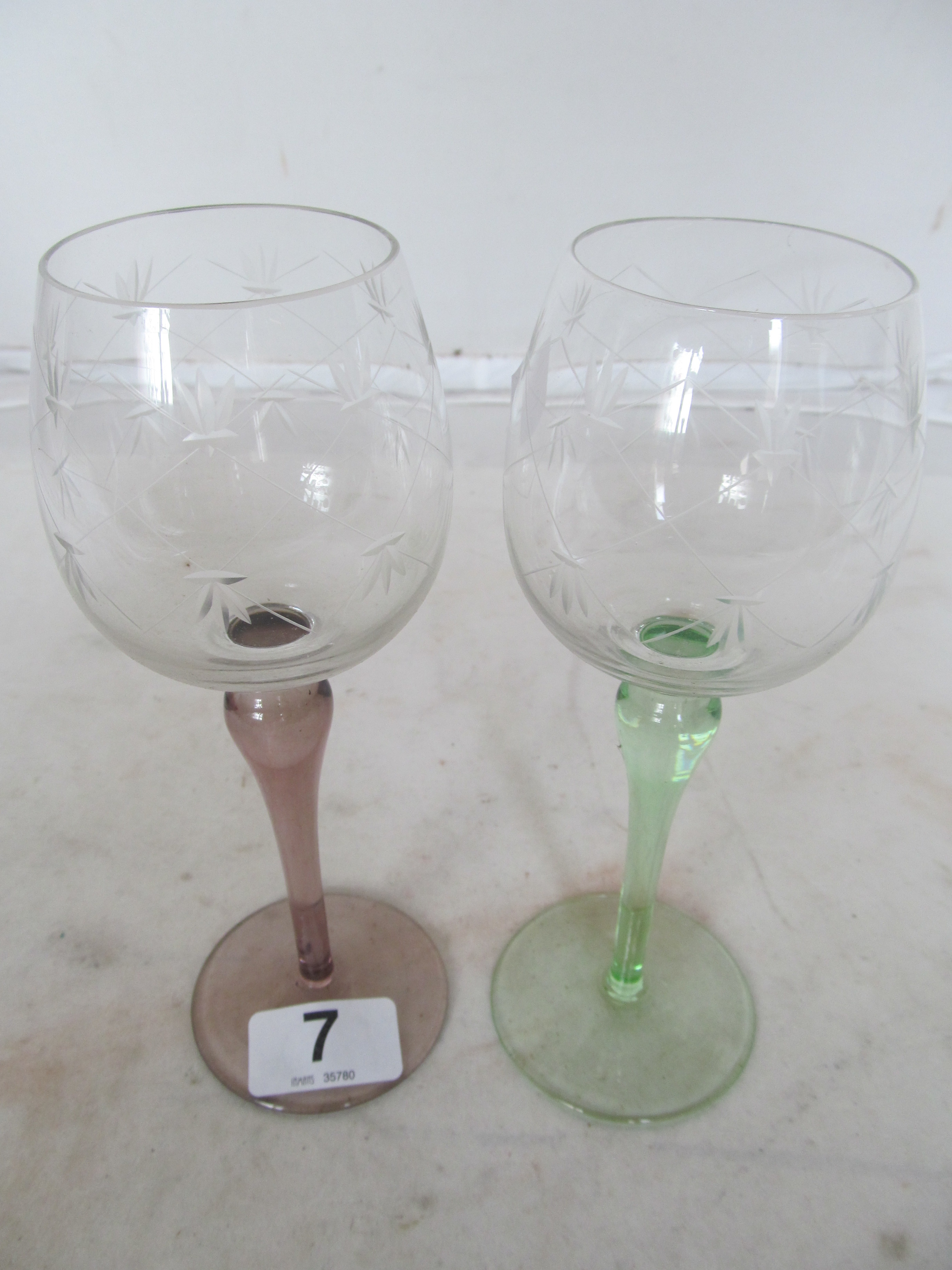 A set of six coloured stem wine glasses