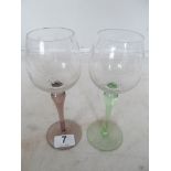 A set of six coloured stem wine glasses