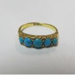 An 18ct gold and turquoise ring set diamond chips